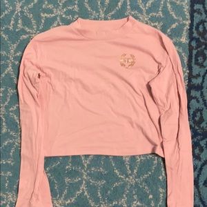 pink cropped long sleeve shirt